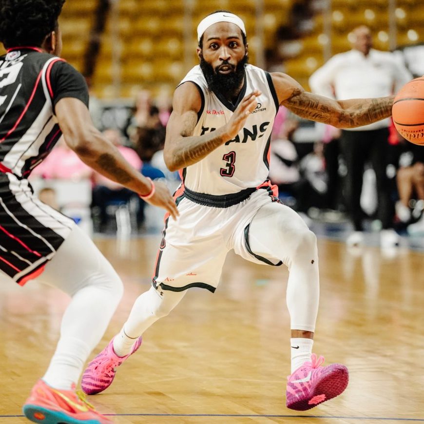 KW Titans' James Towns moves to avoid the Windsor Express in a tight raced game Feb 22, 2026 on home court (Credit: Karsen Campbell)